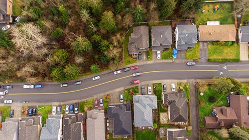 CANUE | Webinaires et coursAerial view of residential neighborhood surrounded by trees. A s