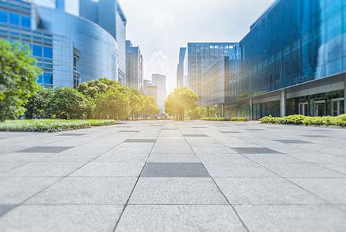 CANUE | Webinaires et coursEmpty brick floor with modern buildings