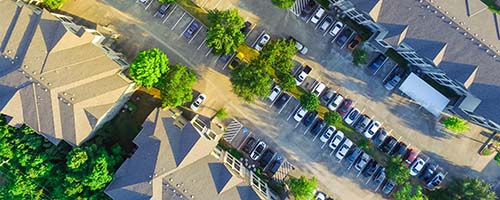 CANUE | Webinaires et coursPanorama aerial view of apartment garage with full of covered pa