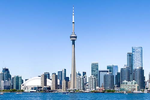 CANUE | Webinaires et coursToronto skyline with blue clear sky, Canada. All branding from b